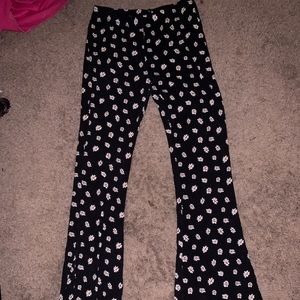 Black flower bell bottom leggings.